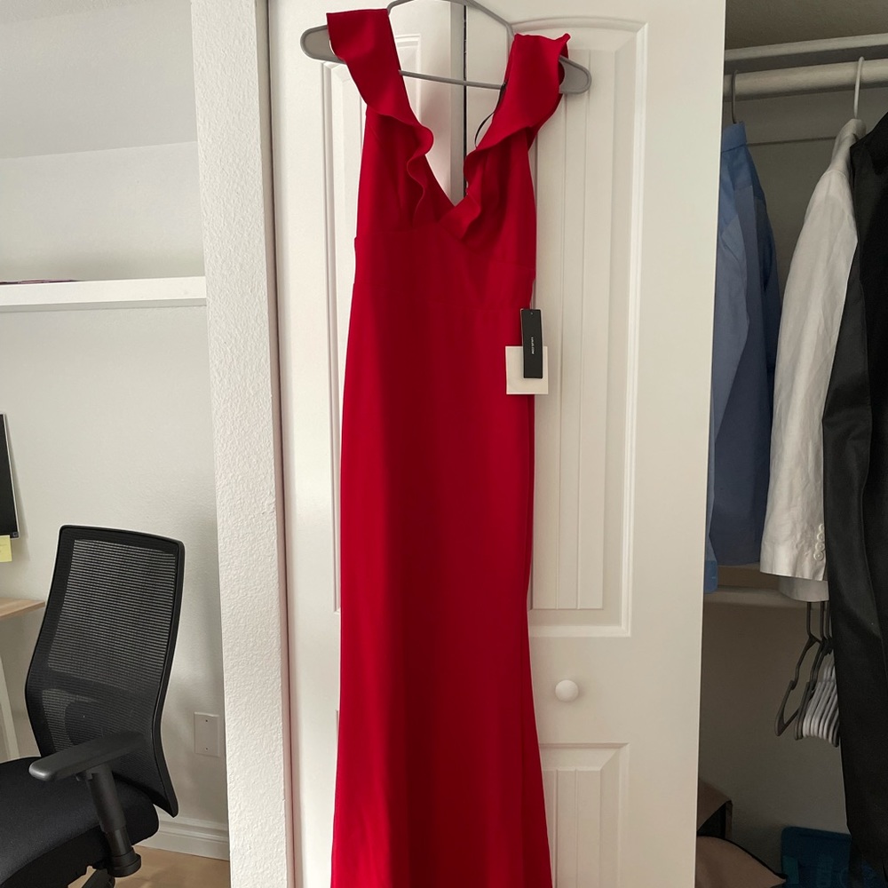Red form fitting formal gown. Never worn!
